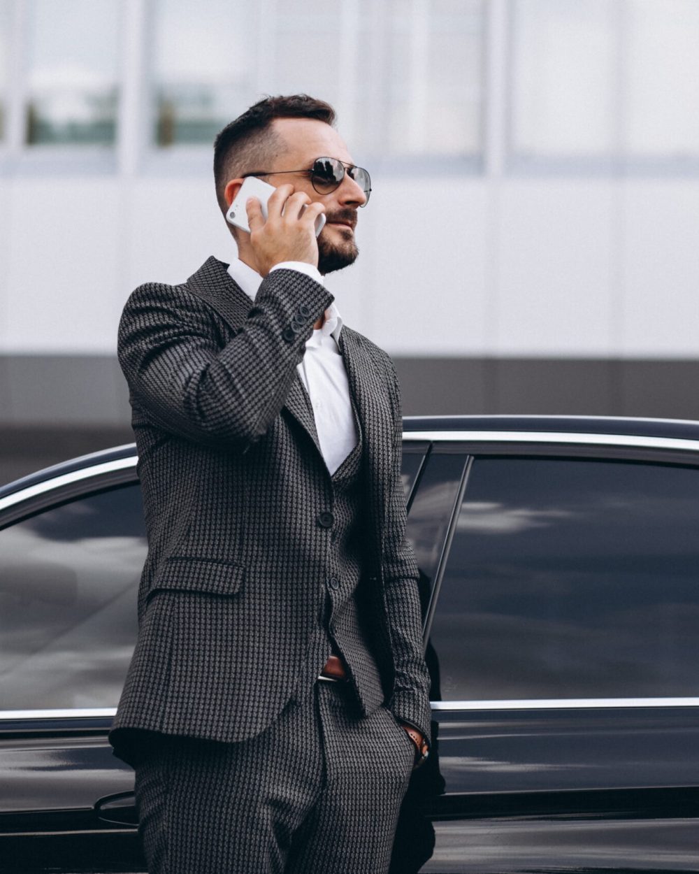 business-man-by-car-talking-phone (1)